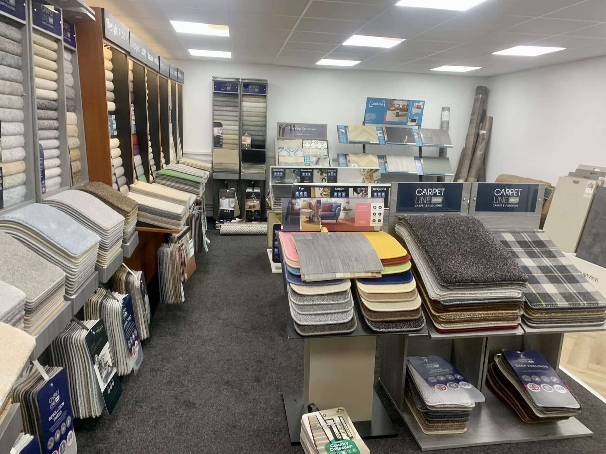 Carpet sample stands and flooring display units in the Keith flooring showroom