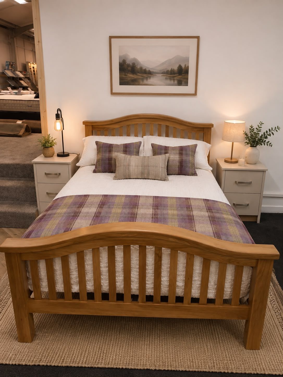 Light oak bed frame dressed with a tartan throw and matching bedside tables in Keith