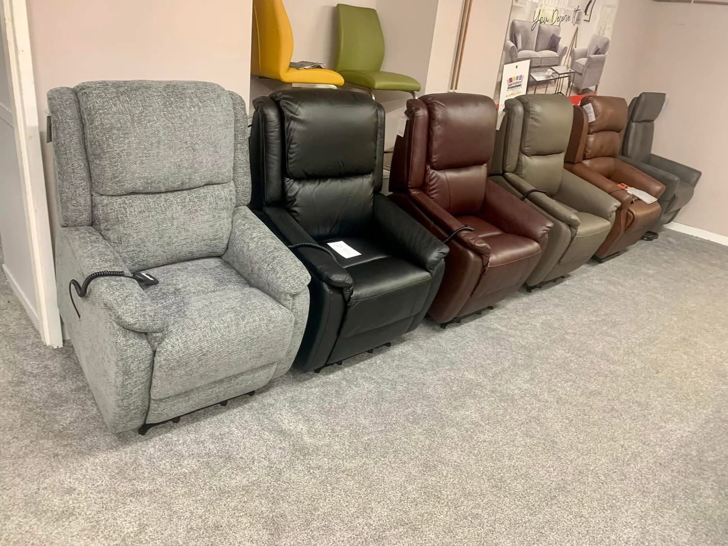 Collection of leather and fabric riser recliner chairs in the Keith mobility showroom