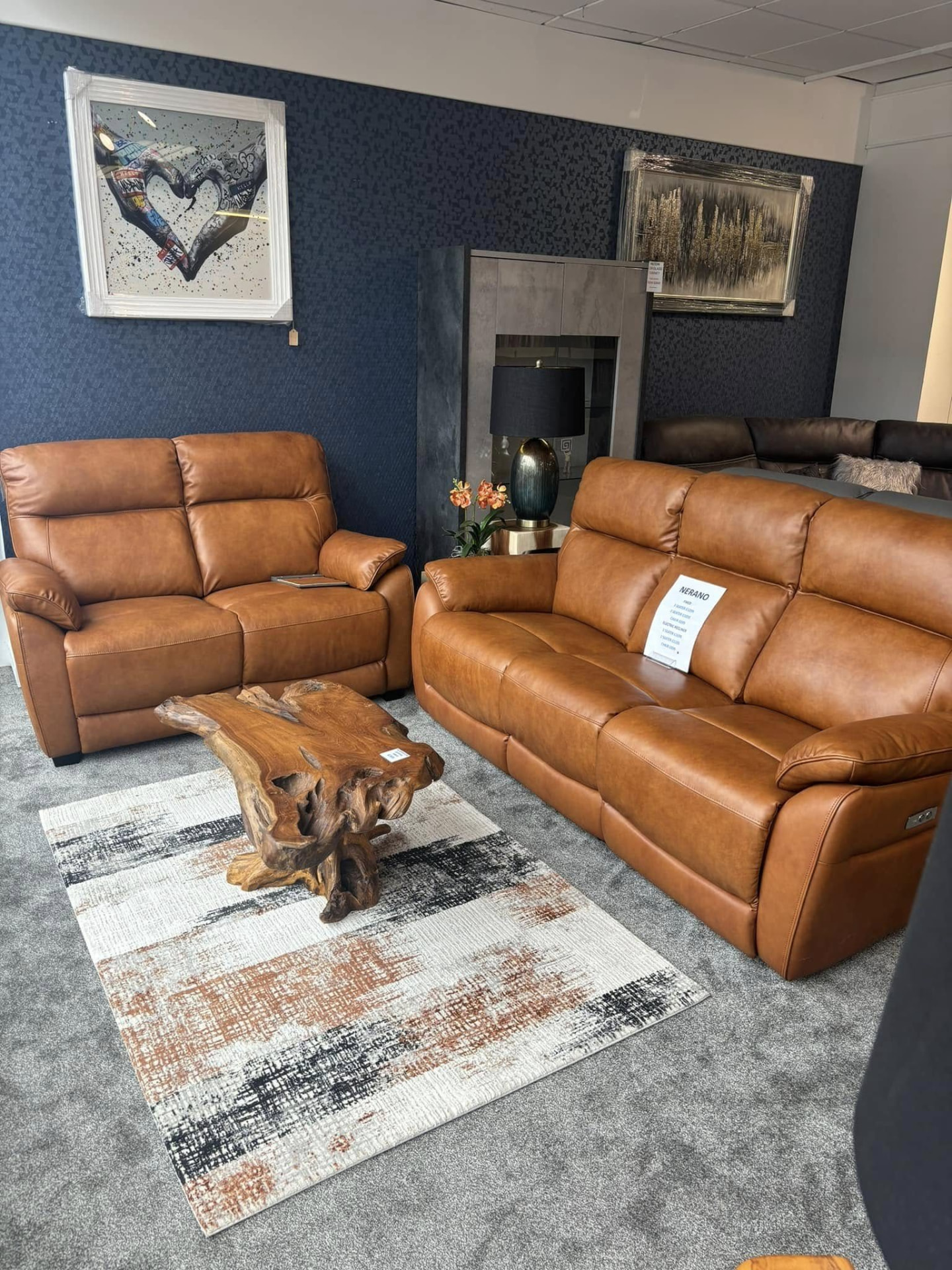 Tan leather sofa suite with a natural wood coffee table