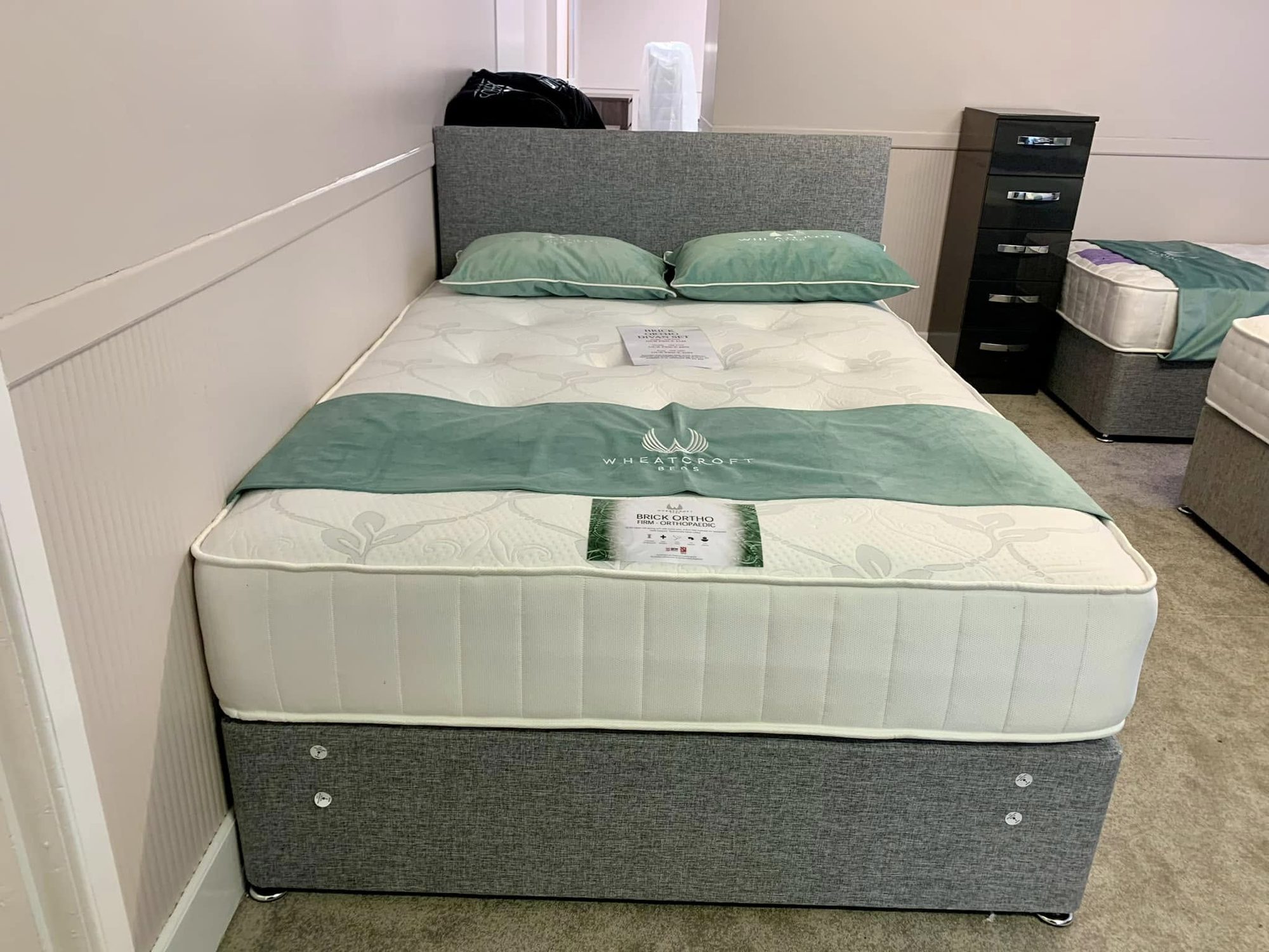 Wheatcroft firm orthopaedic mattress on a grey divan base, available to try in Keith