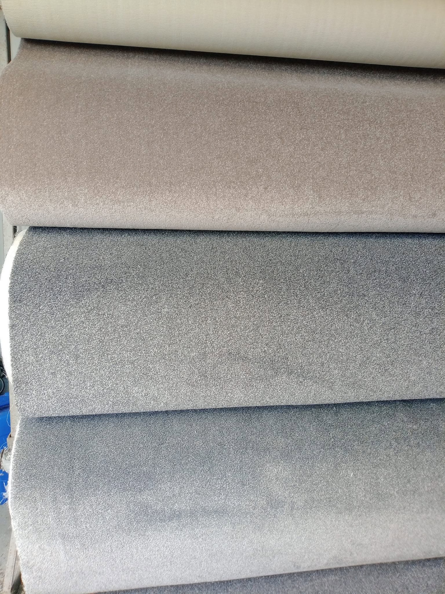 Sofa upholstery fabric swatches in grey and beige shades to choose from